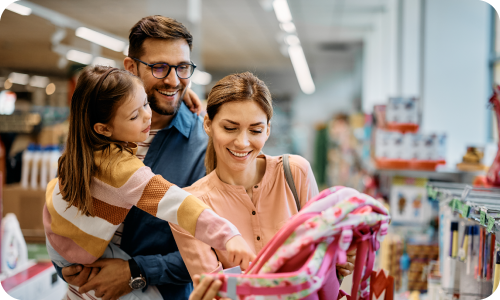 Parents back-to-school shopping with daughter
