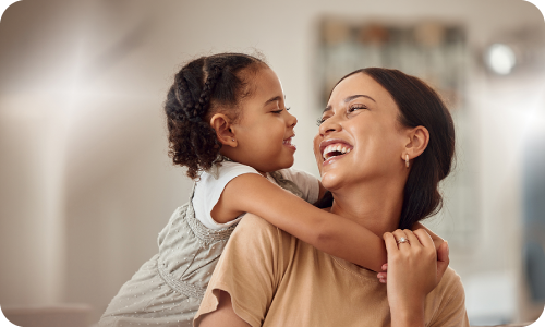 young daughter embracing mother